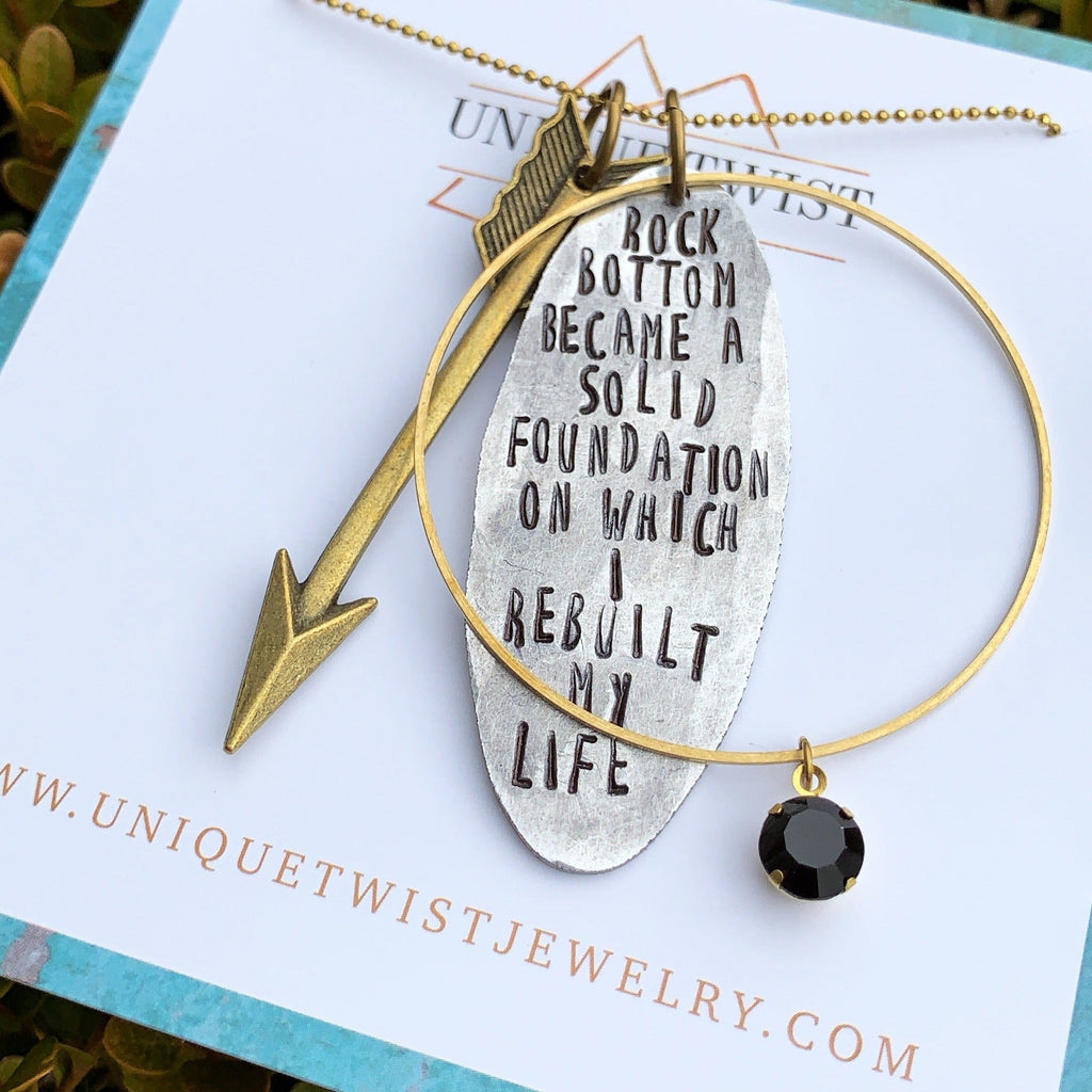 "Rock Bottom Became a Solid Foundation on Which I Rebuilt my Life" Hand-Stamped Necklace. Handmade jewelry by Unique Twist Jewelry.