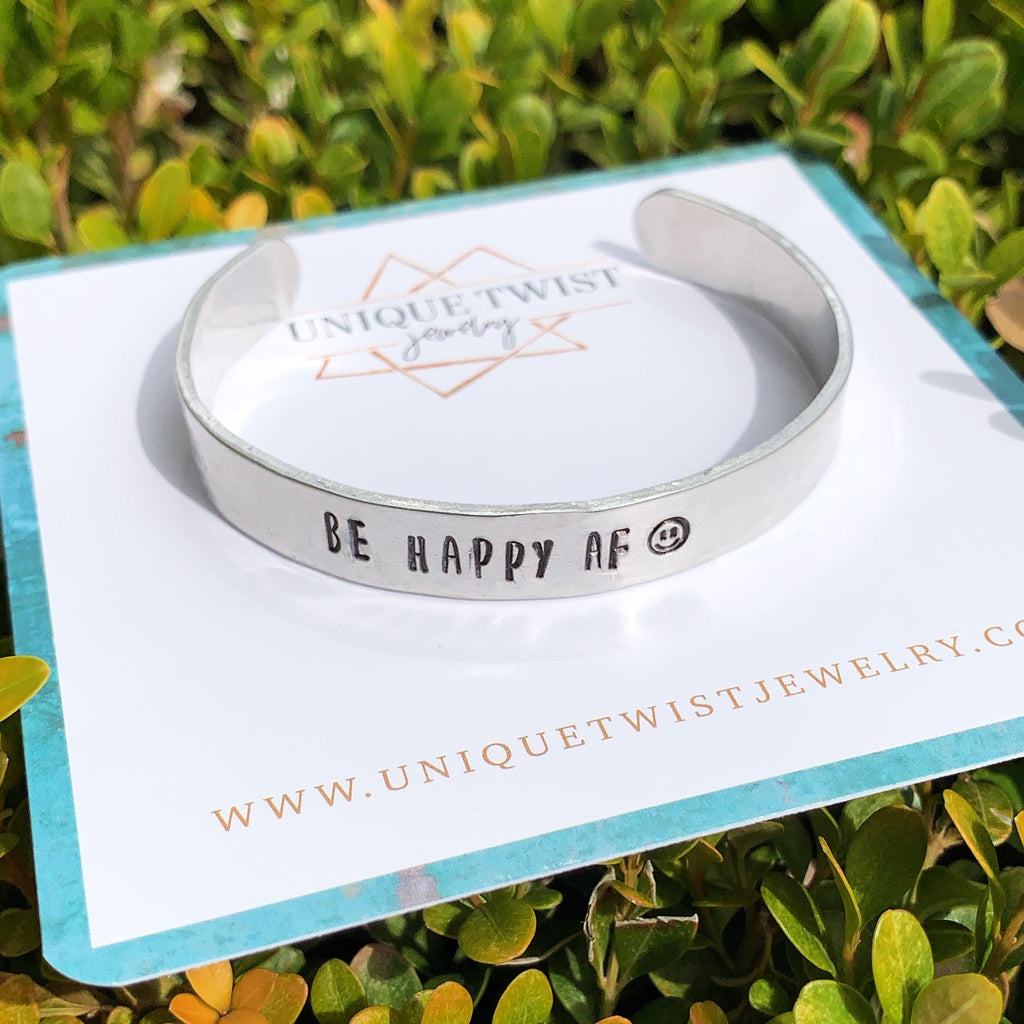 "Be Happy AF" Hand-Stamped Metal Cuff. Handmade fashion accessories by Unique Twist Jewelry.