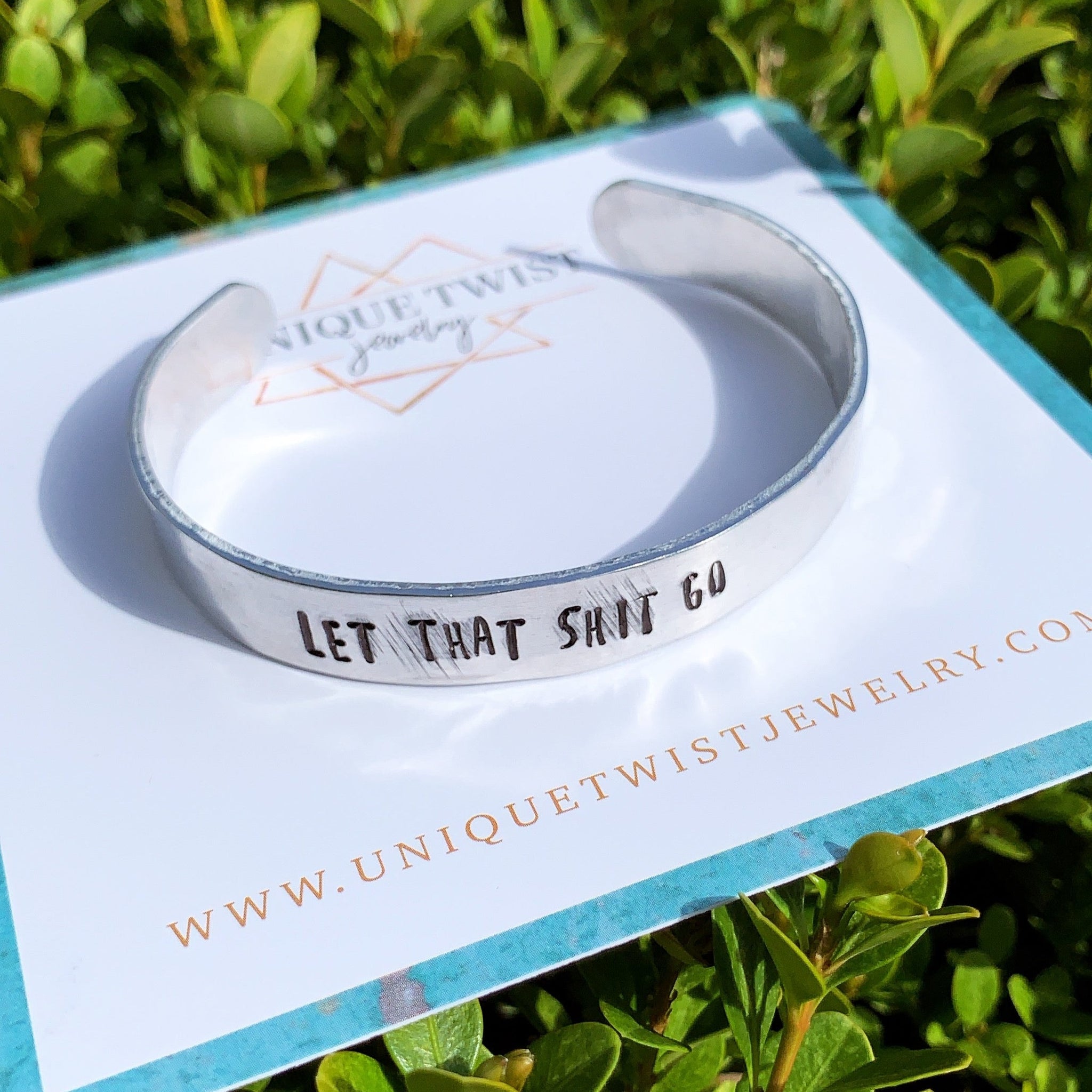 Aluminum "Let that shit go" Hand-Stamped Cuff Bracelet. Handmade jewelry by Unique Twist Jewelry.
