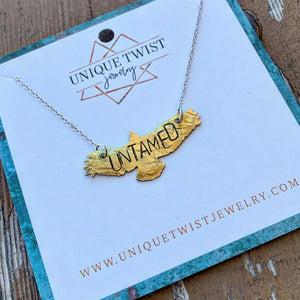Handstamped "UNTAMED" free bird on an 18" chain necklace. Handmade by Unique Twist Jewelry