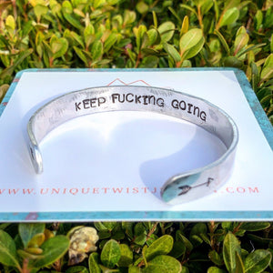 Aluminum "Keep Fucking Going" Hand-Stamped Inspirational Cuff Bracelet. Handmade jewelry by Unique Twist Jewelry.